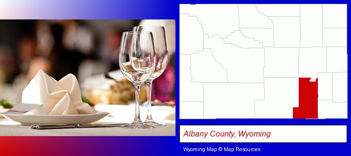 a restaurant table place setting; Albany County, Wyoming highlighted in red on a map