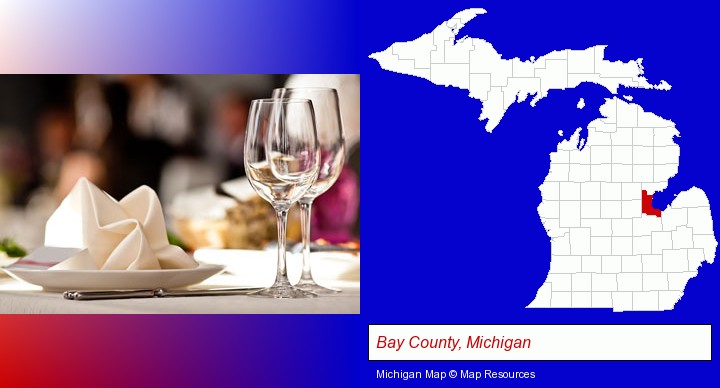 a restaurant table place setting; Bay County, Michigan highlighted in red on a map
