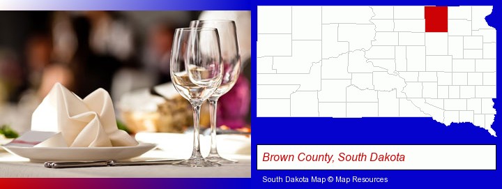 a restaurant table place setting; Brown County, South Dakota highlighted in red on a map